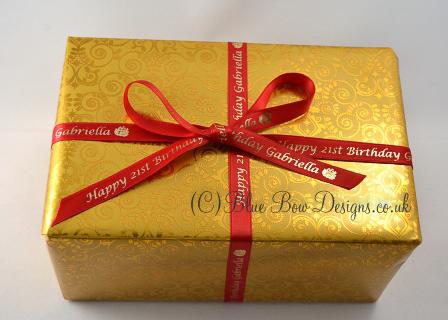 10 mm red and gold personalised ribbon on a gold present