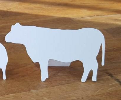 White cow shaped place card with back stand
