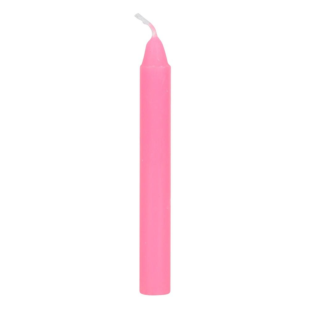 A single pink 'friendship' spell candle, for use with rituals to attract friendship and emotional well-being.