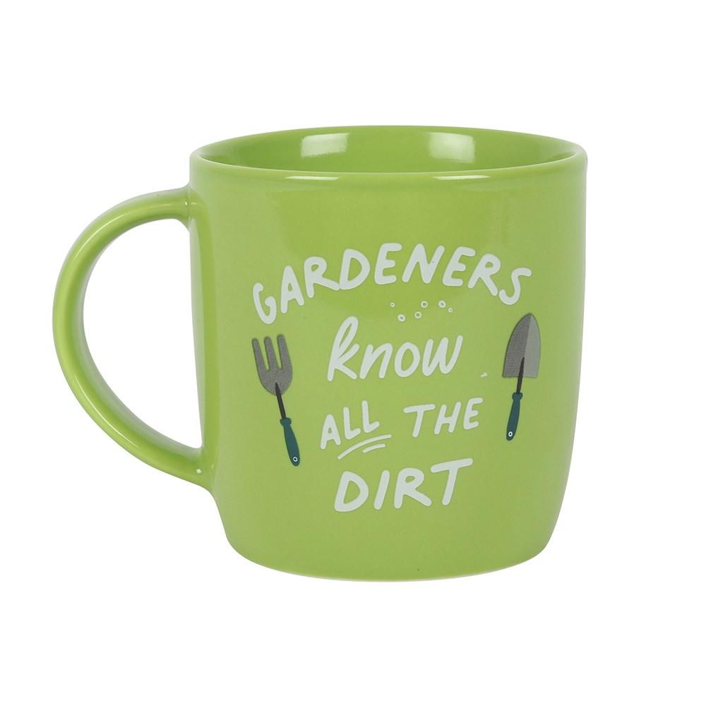 Lime green ceramic mug with garden tool designs printed on either side and humorous 'Gardeners know all the dirt text'