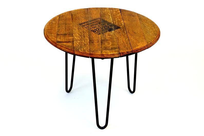 A rustic bourbon barrel head side table.