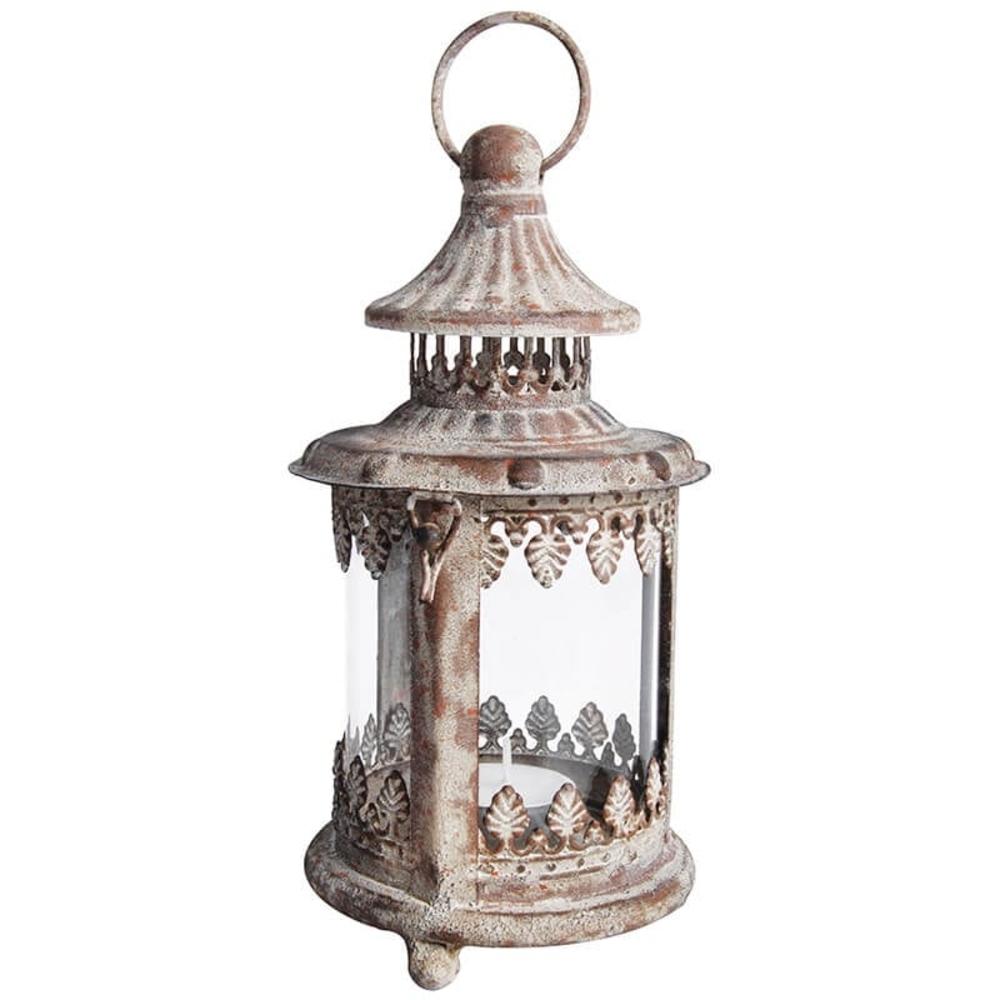 A small round aged metal lantern with a ring for hanging and door for placement of tealights.