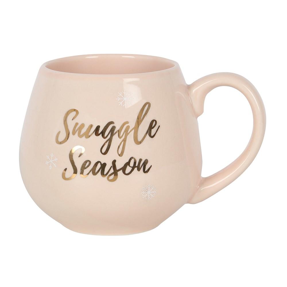 Pink ceramic Christmas mug with rose gold 'Snuggle Season' text and snowflakes, rear view.