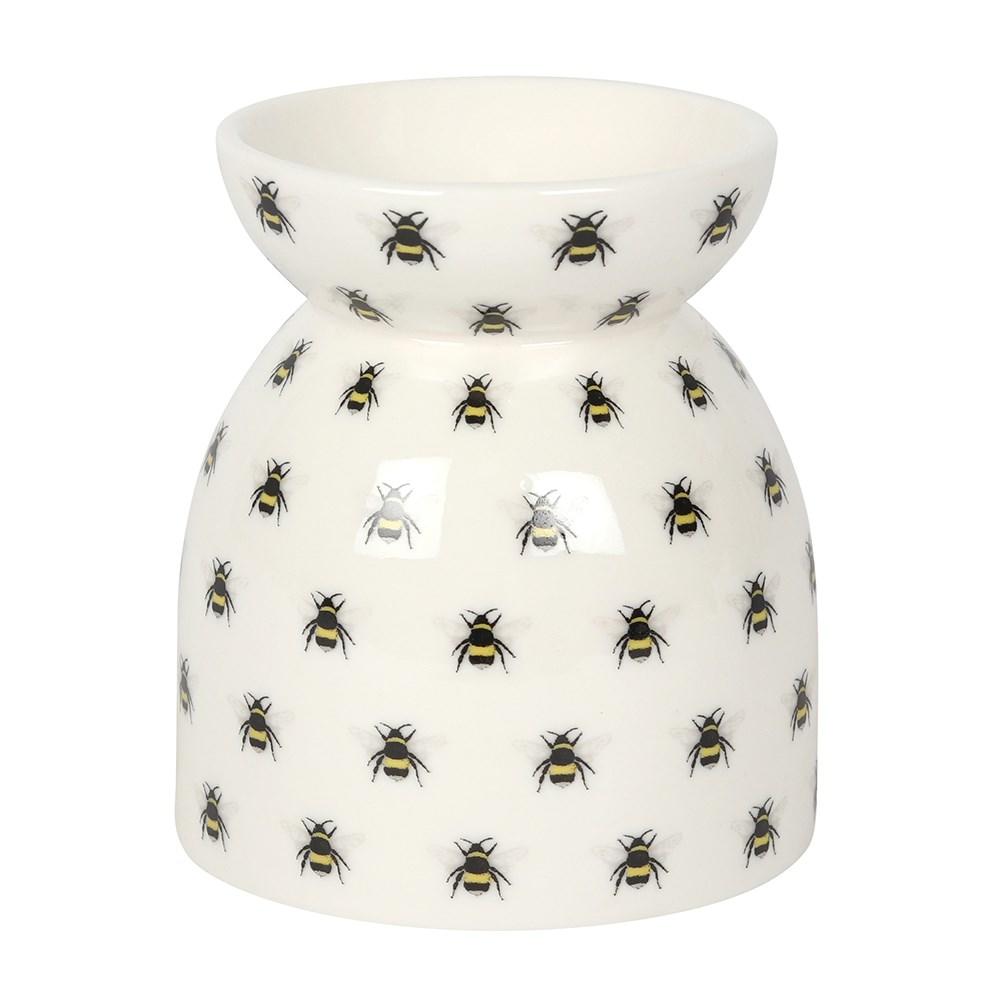 Rear view of the All Over Bee Print Ceramic Oil Burner holding a lit tealight candle..