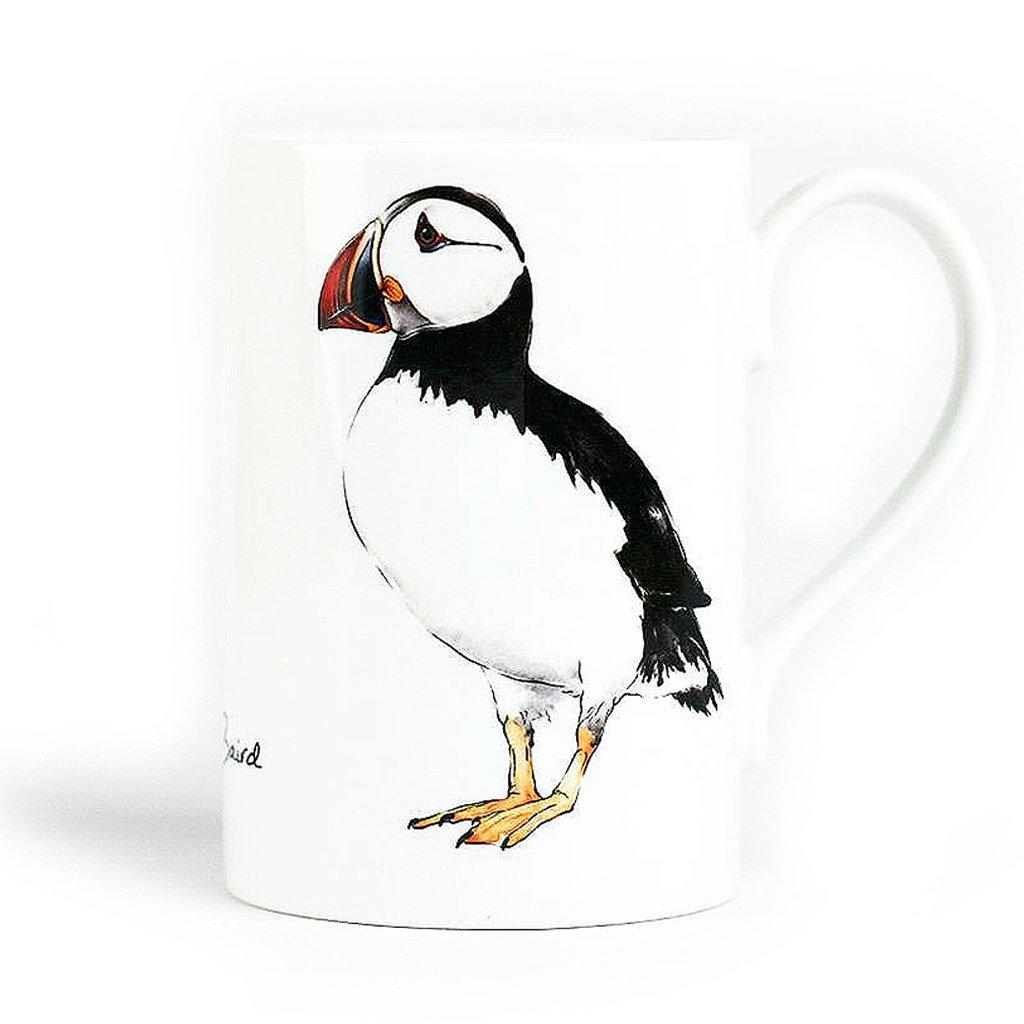 A beautiful white porcelain mug with a hand painted puffin on the front