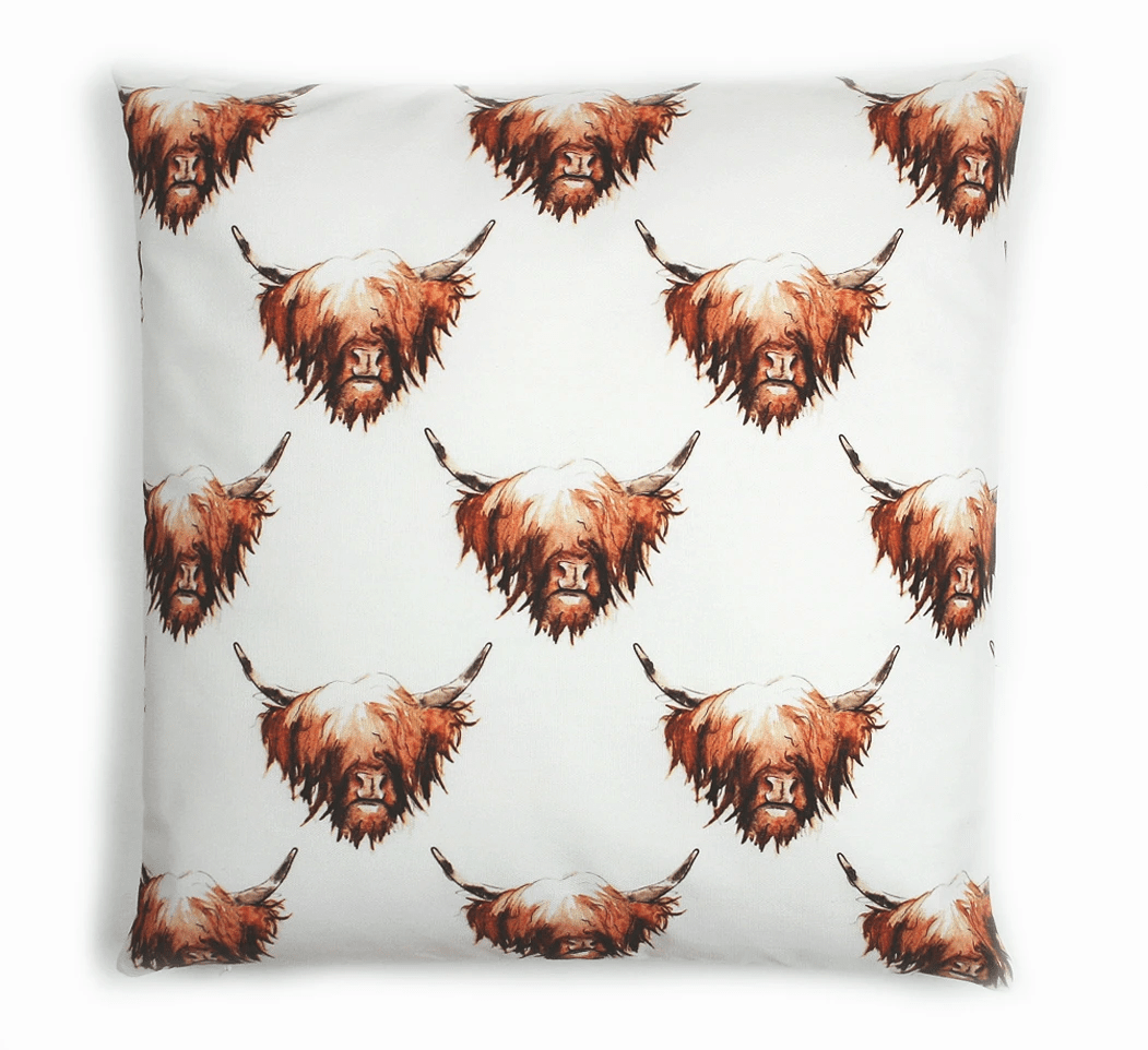Reversible design - Highland cow cushion shows small patterned highland cows on the reverse, by Clare Baird.