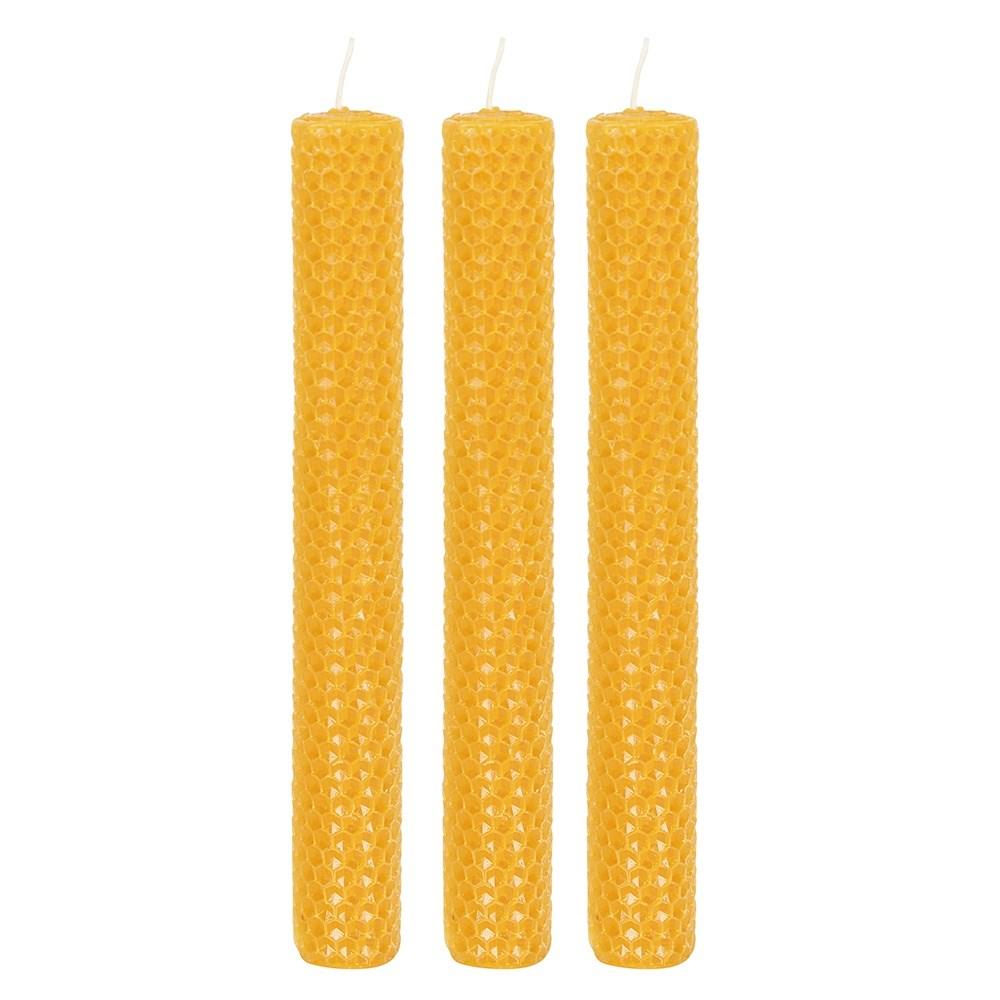 Set of three 100% natural beeswax dinner candles in a rolled honeycomb texture with a delicate honey scent, shown out of box.