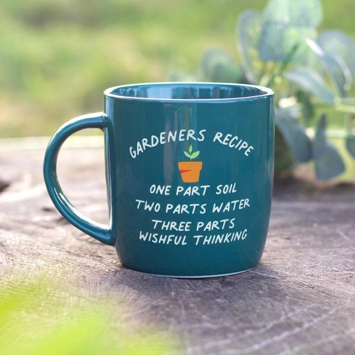 Dark green ceramic mug with 'Gardeners Recipe' text and a potted plant design.