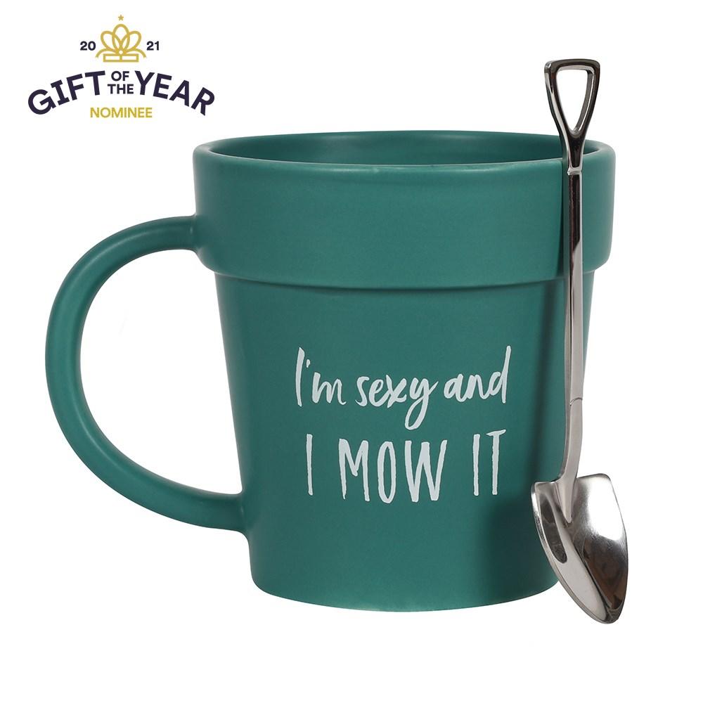 Plant pot-shaped green mug with matching shovel spoon and 'I'm sexy and I mow it' text, a whimsical design.