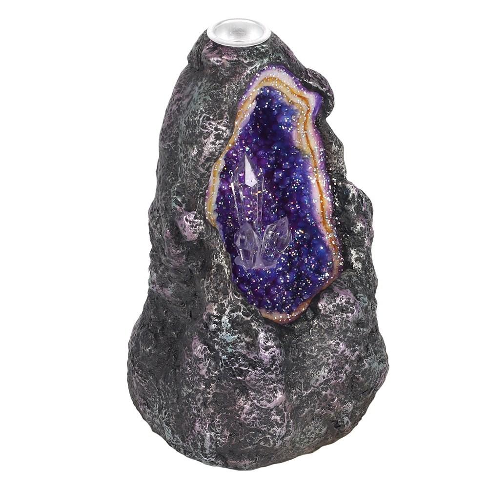 Side view of Glowing crystal cave backflow incense burner, featuring colour changing crystals in a geode-like opening.