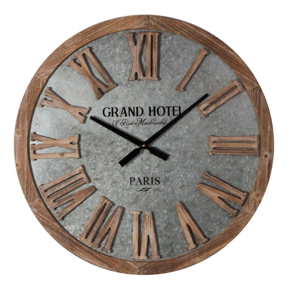 Round barrel-end style wall clock with 'Grand Hotel' and 'Paris' text, roman numeral dial, metal face & straight black hands.