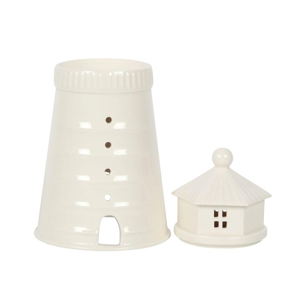 White light house lidded wax warmer and oil burner, shown with lid off.