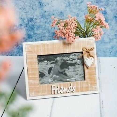 Shabby Chic Rustic Photo Frame with 'Friends' text on the bottom & heart pendant on the right, on a white table with flowers.