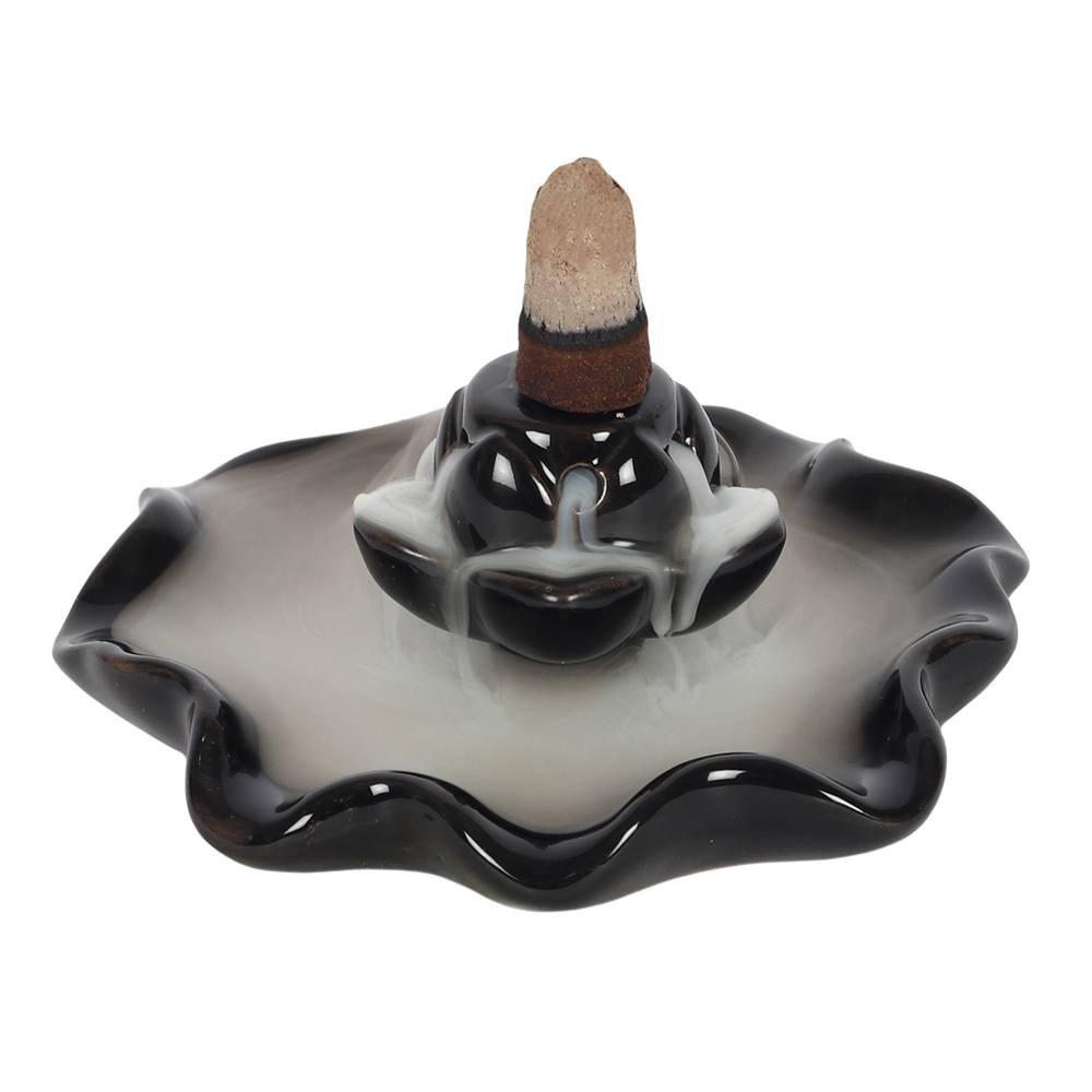 Backflow incense burner in a black ceramic lotus pool design, the smoke cascades down in a waterfall effect to the pool.