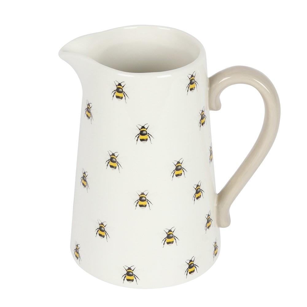 A white ceramic flower jug featuring an all over bee print and a grey contrasting handle, view from above.