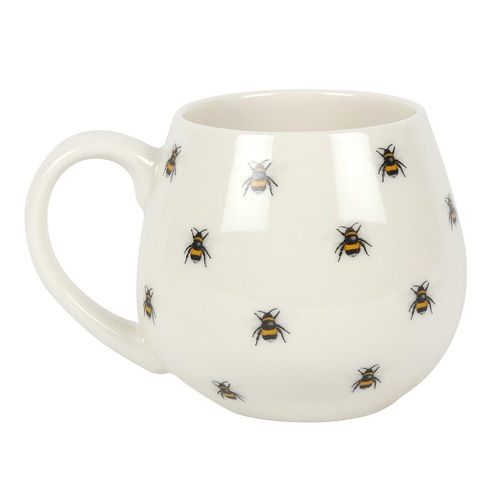 A white rounded mug with all over bee print.