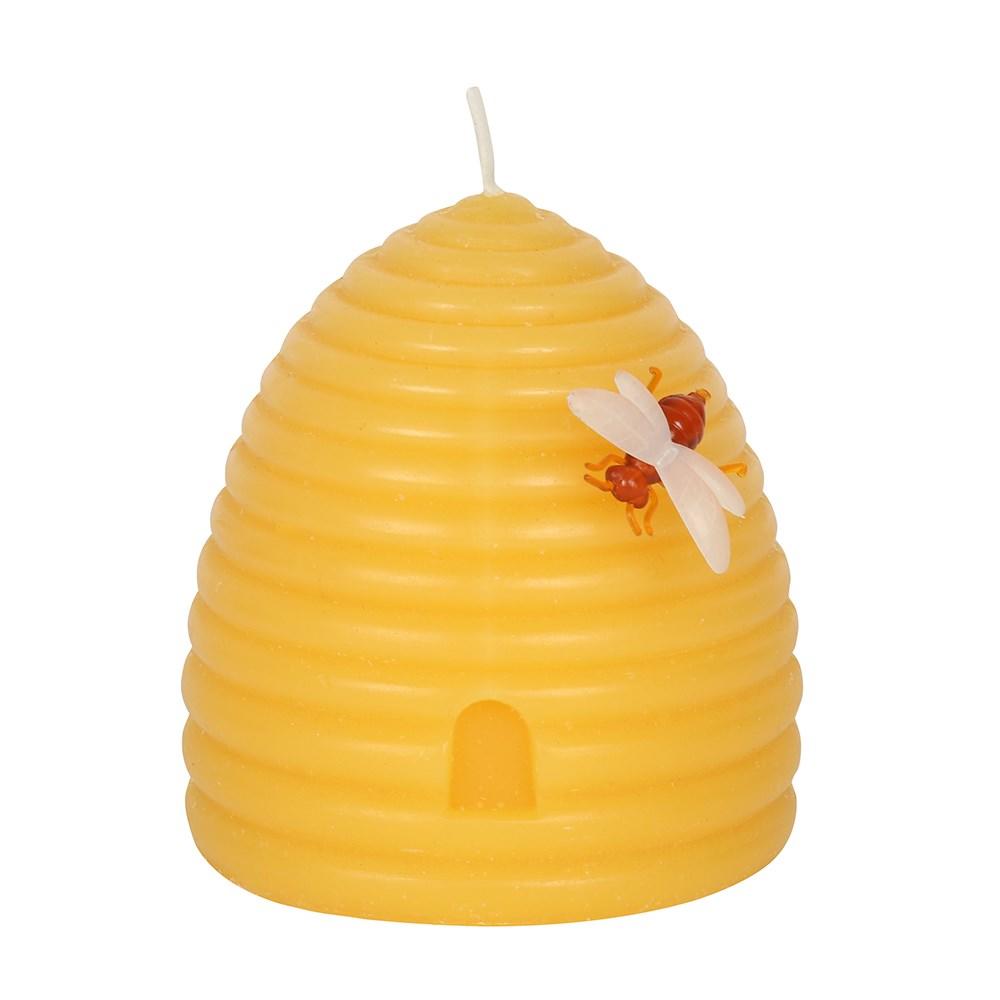 Yellow beeswax hive shaped candle with a bee on the side.
