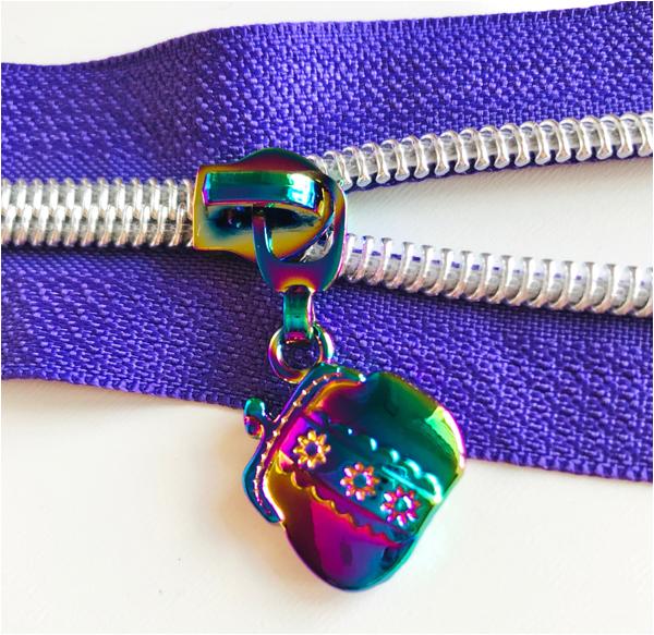 rainbow handbag shaped zipper pull on purple zipper tape