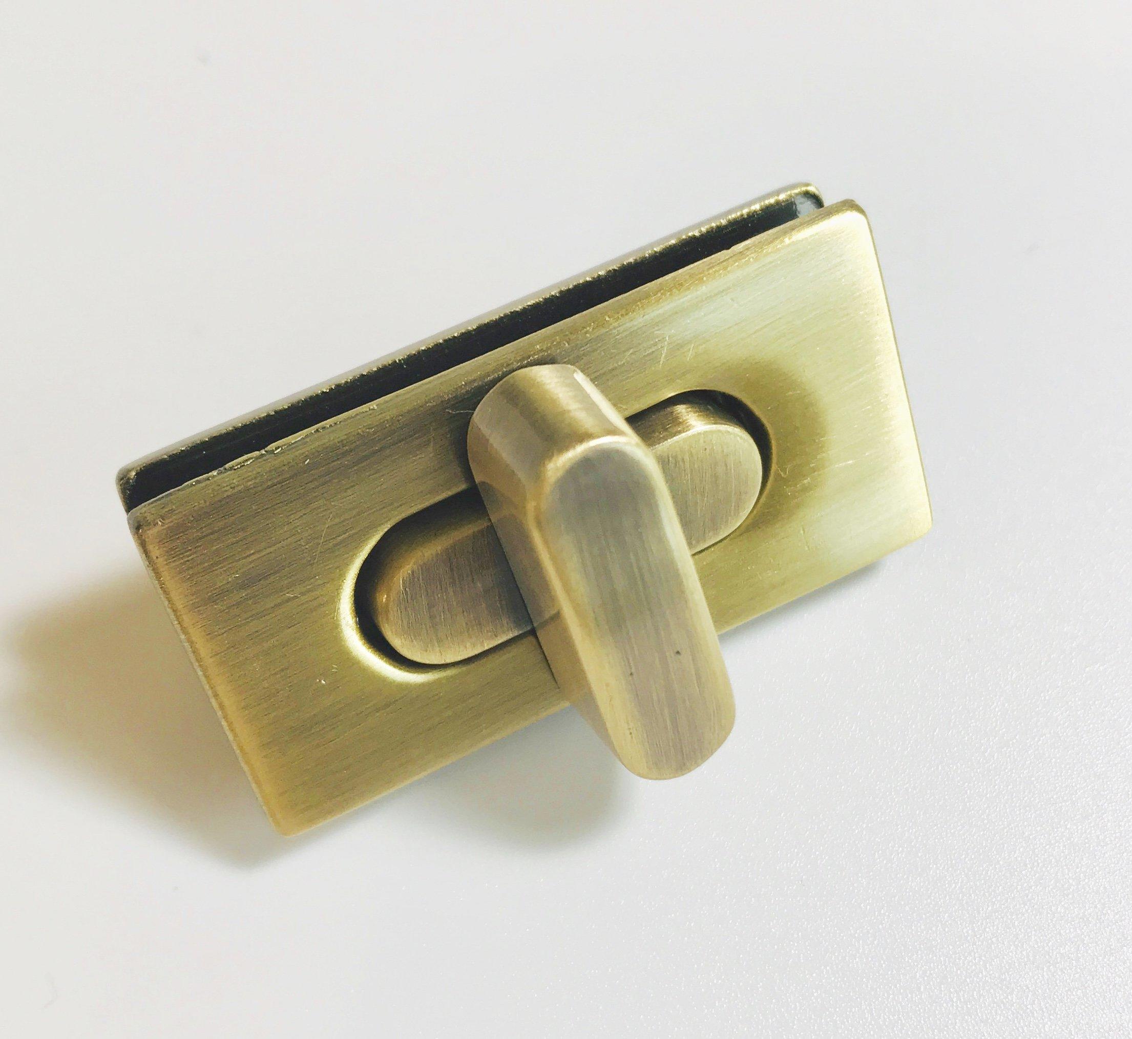 the 35mm wide rectangle turn bag lock is available in two colours, soft antique brass and silver