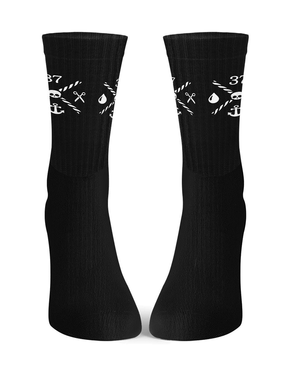 THE QUARTER MASTERS socks in black with white logo
