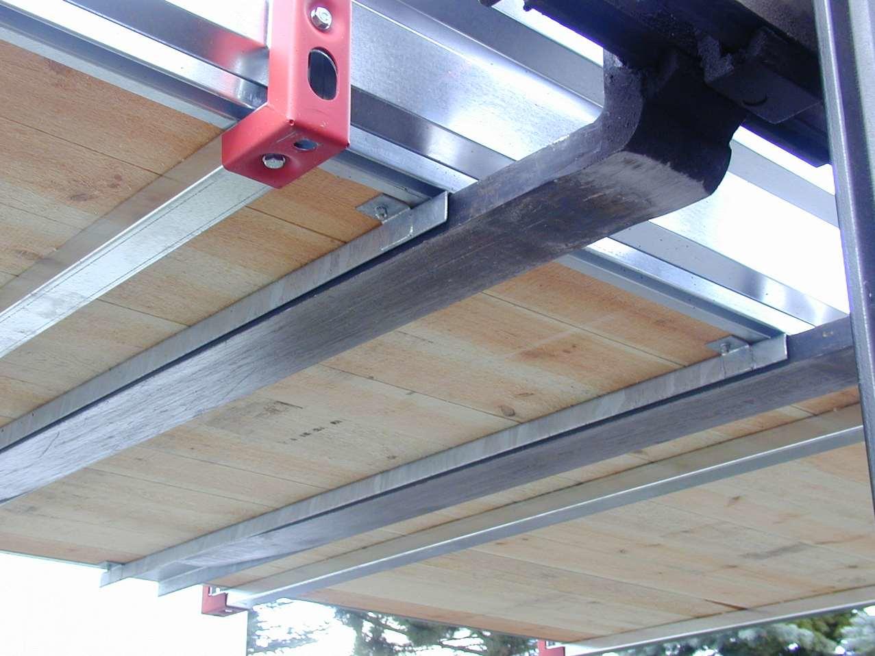 Shipping container with forklift pocket