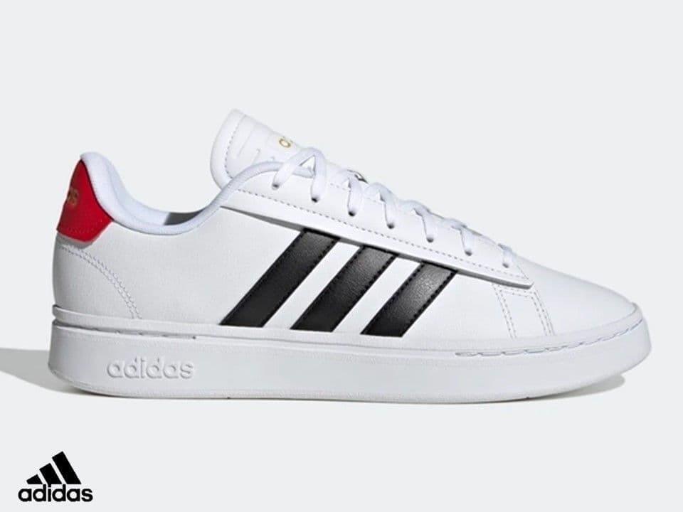 White adidas trainer with logo on the side