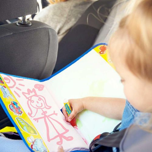 Little girl playing with Aquadoodle in car