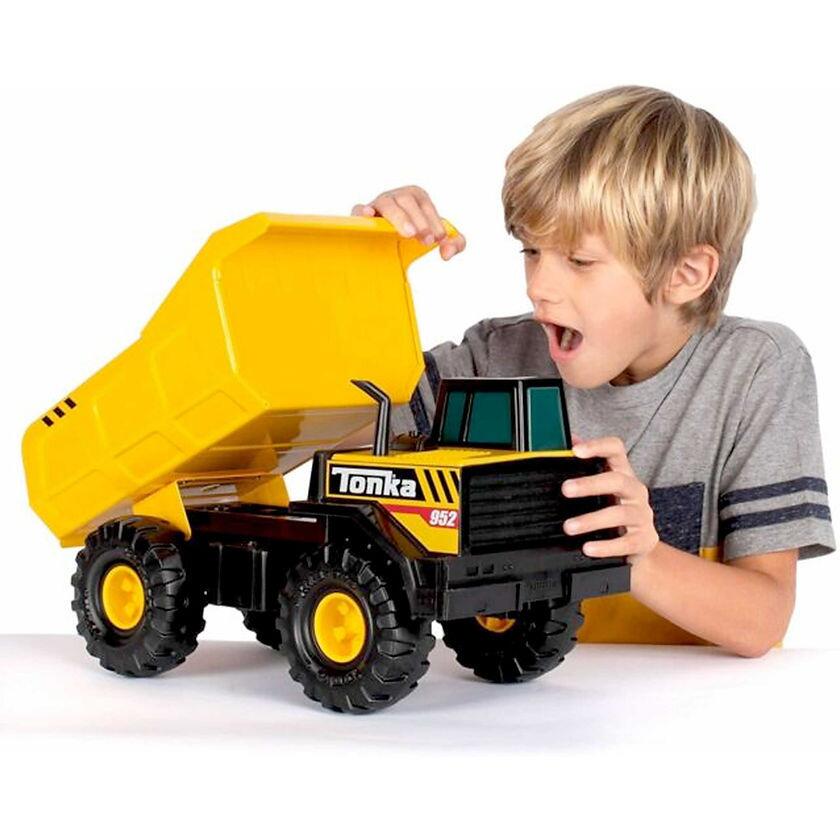 Child Playing With Tonka Steel Classics - Mighty Dump Truck