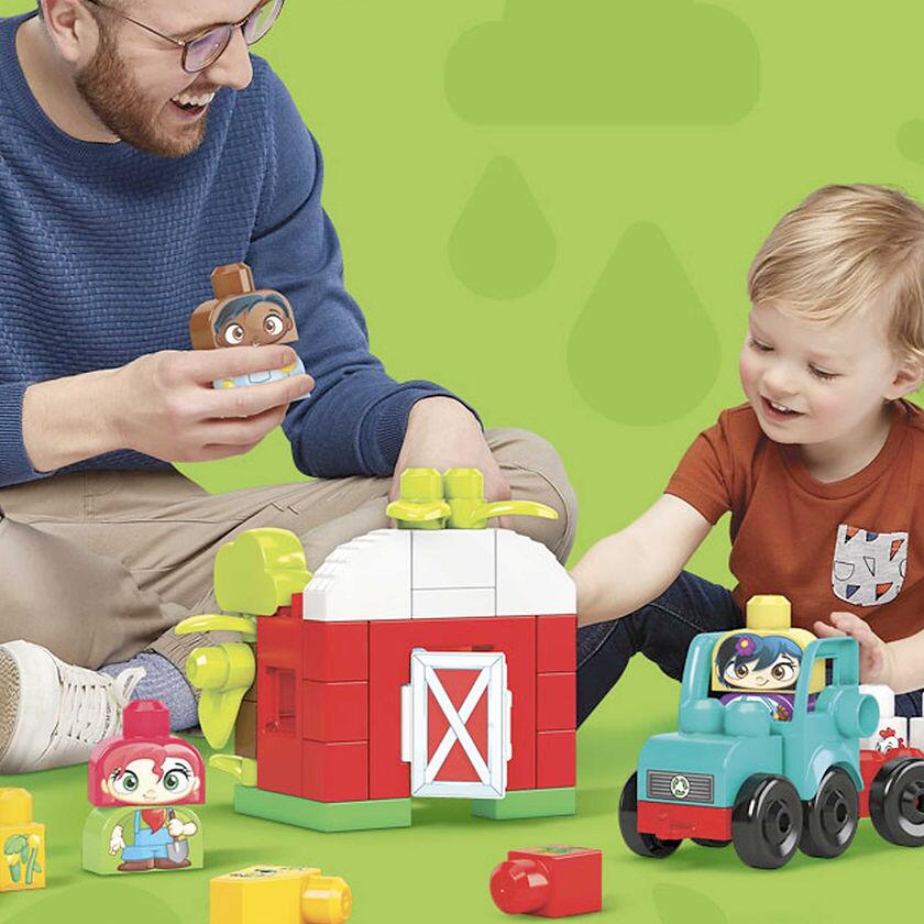 Parent And Child Playing With Mega Bloks Green Town Grow and Protect Farm