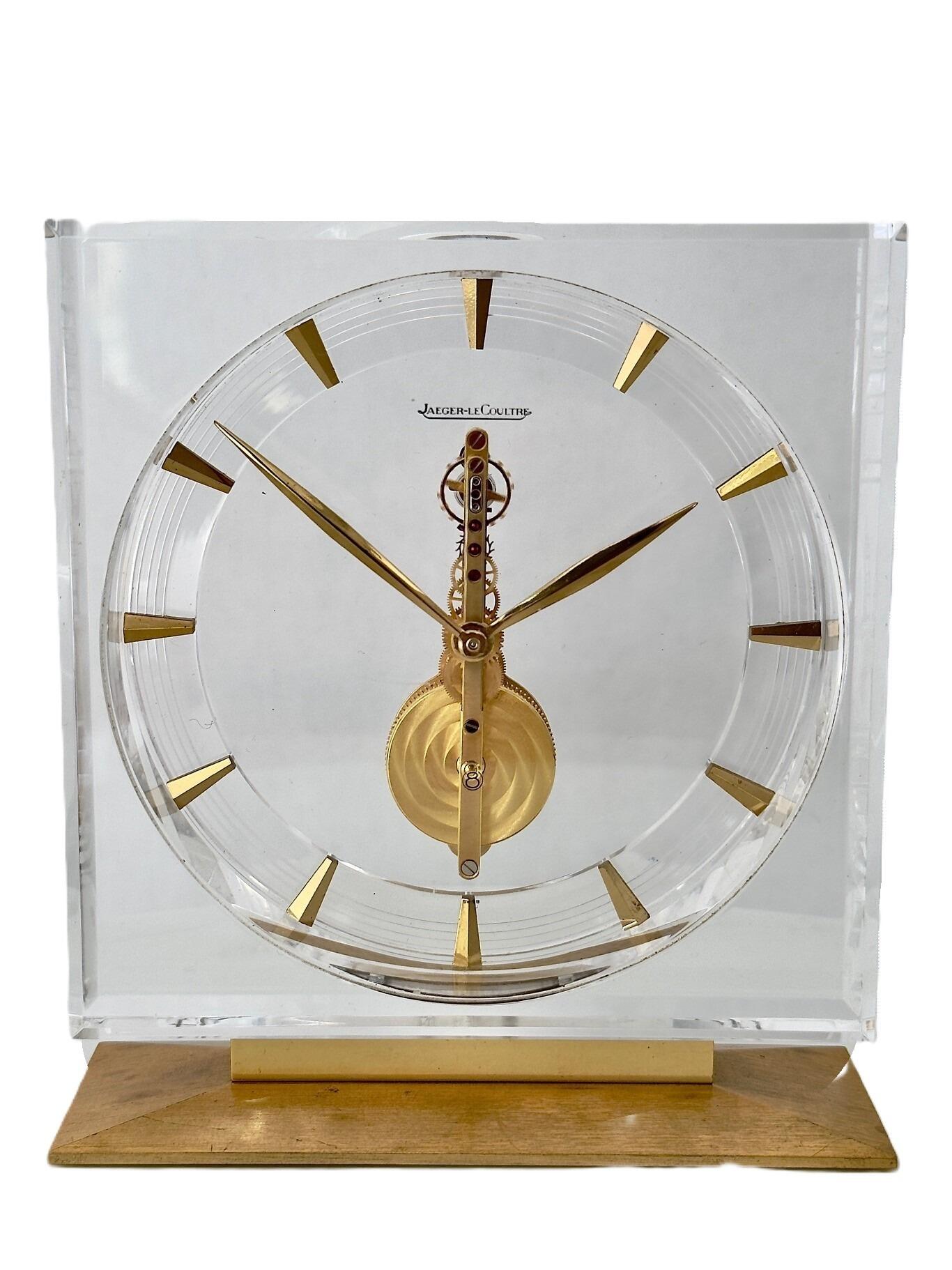 Mid Century desk clock with skeleton mechanism and clear Lucite case