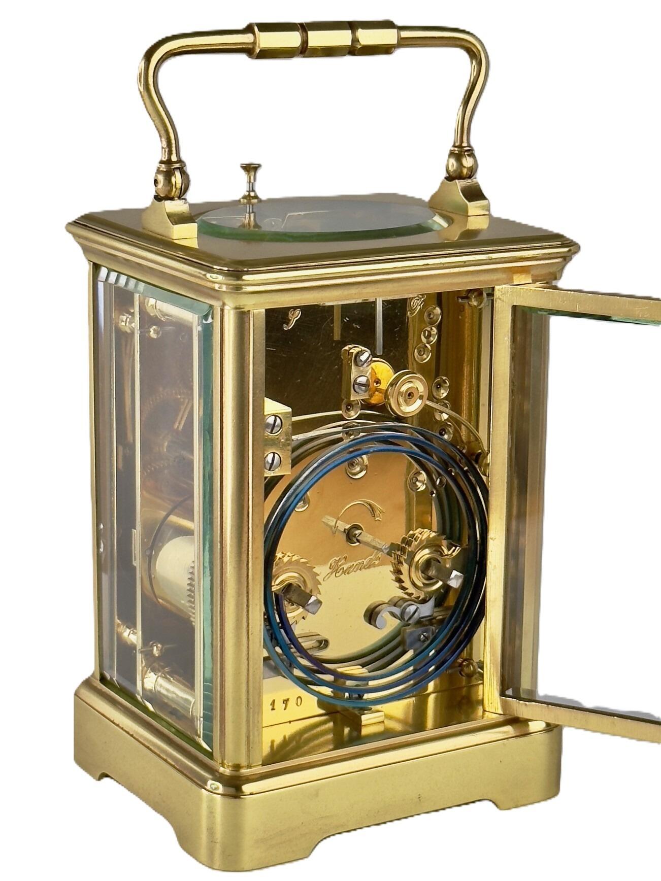 French strike and repeat brass carriage clock with white enamel dial Paris
