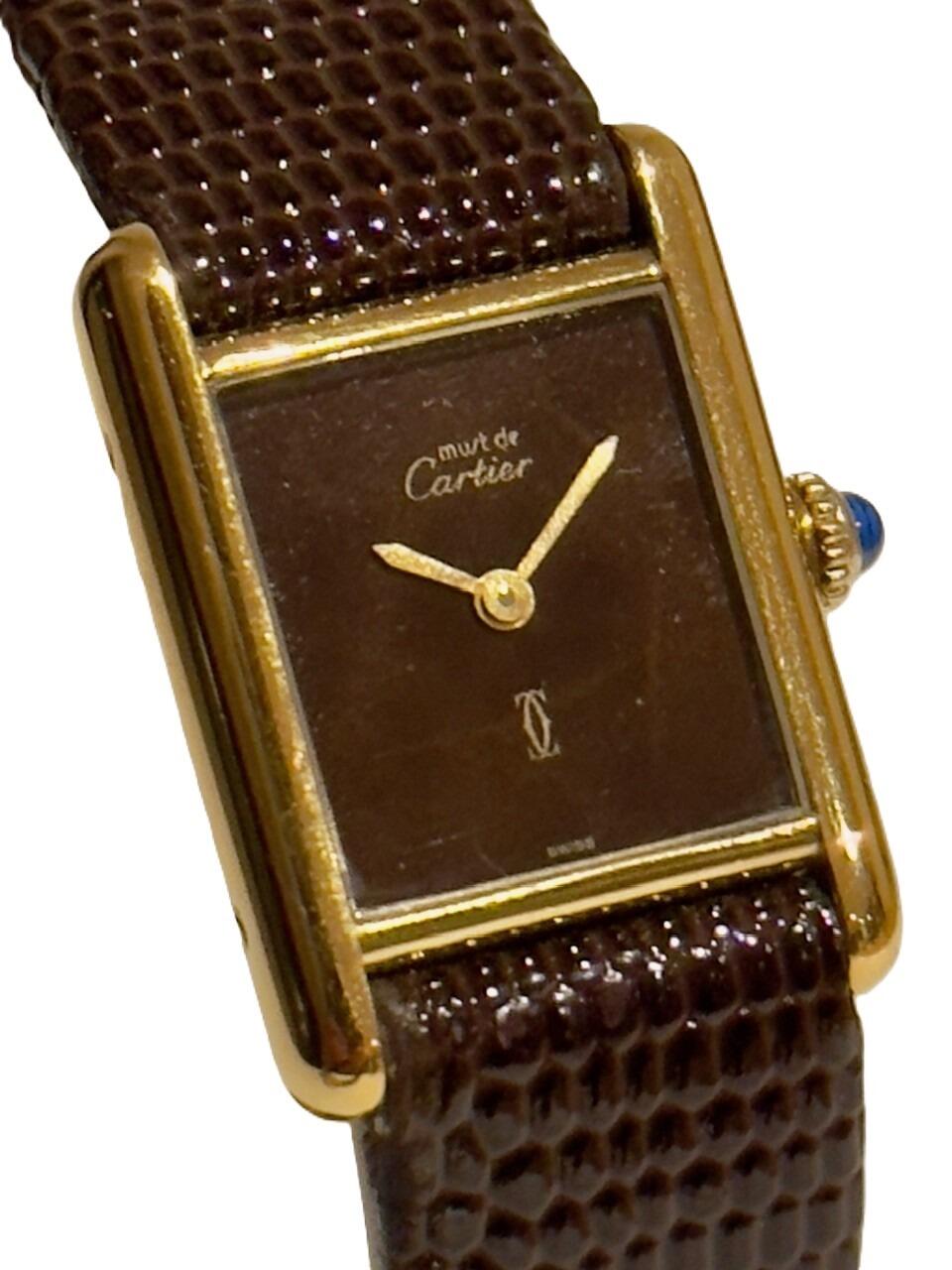 Gold on silver Cartier Tank watch