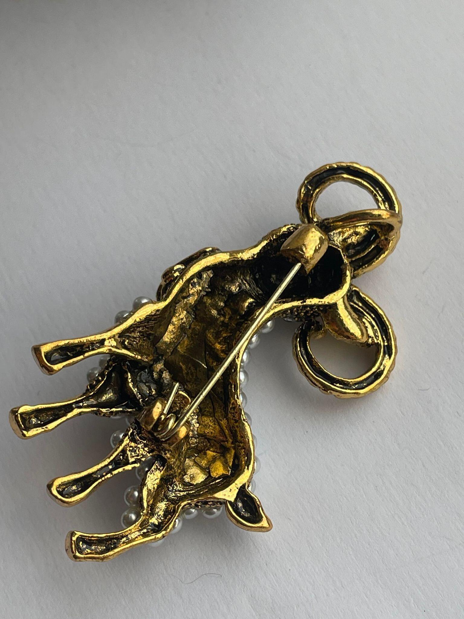 Goat brooch