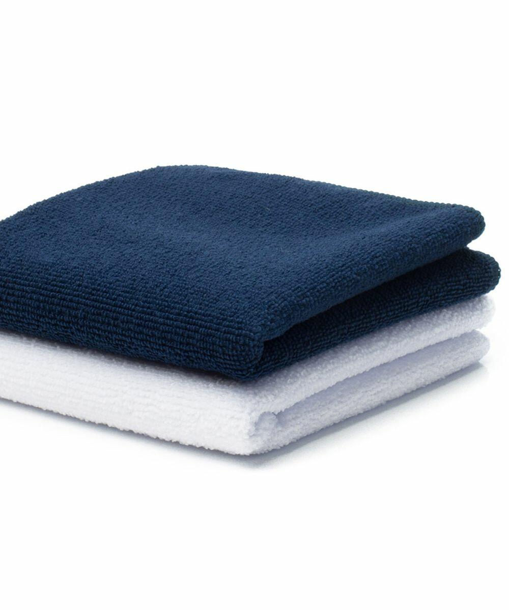 Two folded Towel City TC016 microfiber towels stacked on top of each other; the top towel is dark blue, and the bottom towel is white.