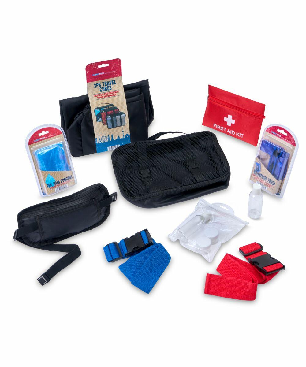 Assorted travel accessories and first aid kit, including travel cubes, waist pouches, compression straps, disposable ponchos, and a small red HL035 with visible medical supplies from Home & Living.