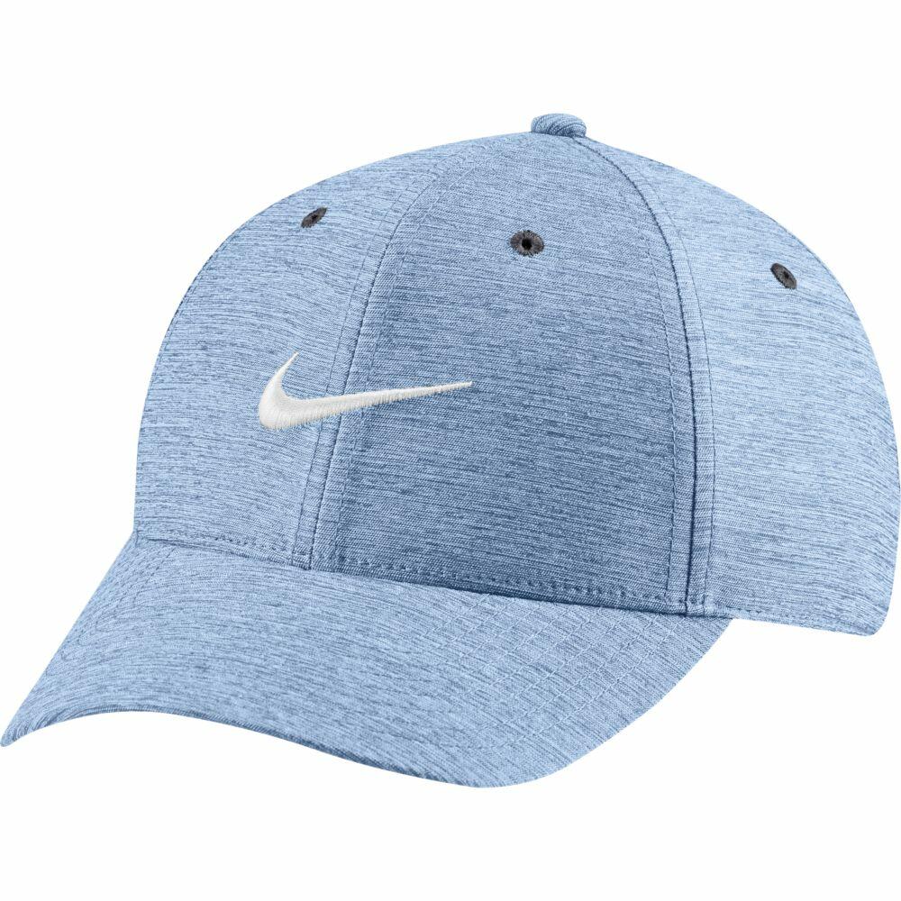 Nike's NK326 cap in light blue features a curved brim and ventilation holes on top, with a white Nike logo prominently displayed on the front.