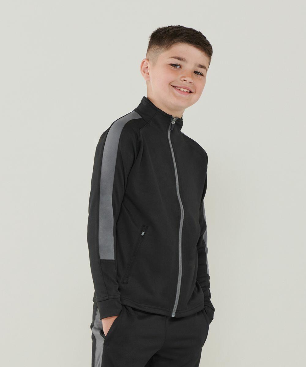 A young boy in a black and gray Finden & Hales LV873 zip-up jacket stan...