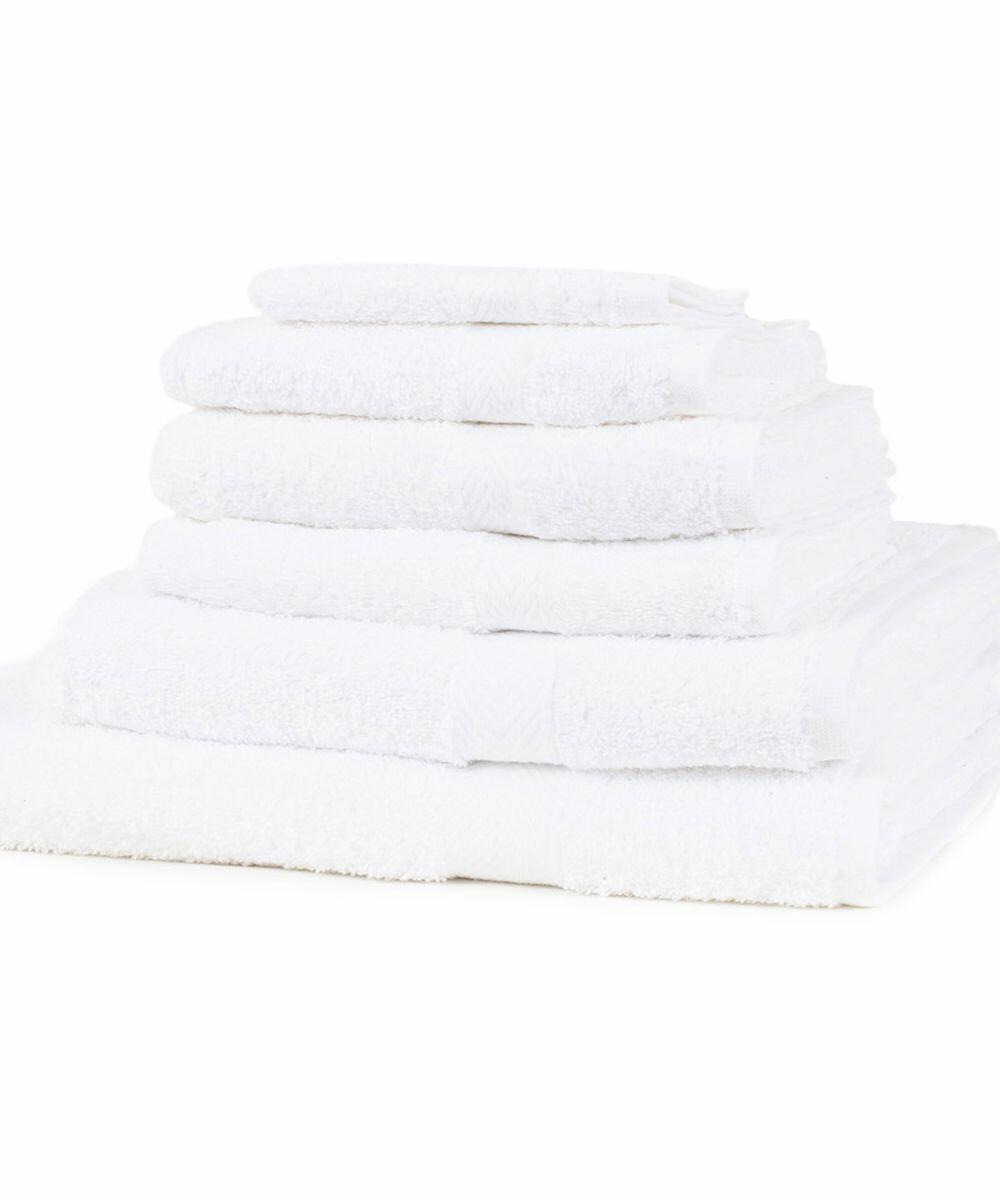 A stack of Towel City TC005 white towels of varying sizes neatly folded on a flat surface.