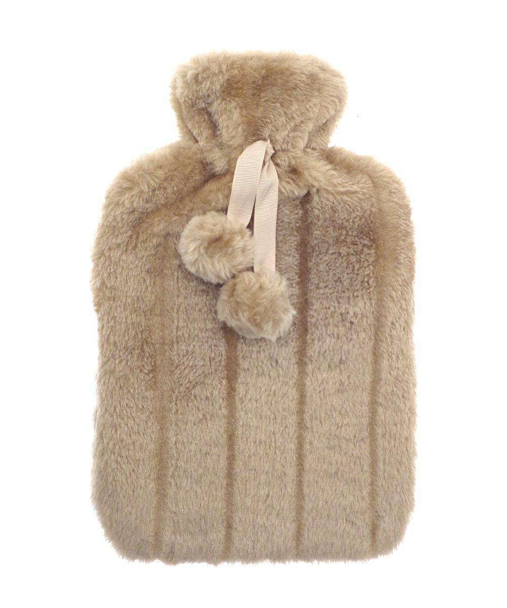 The RI011 by Ribbon is a beige, fluffy hot water bottle cover featuring a drawstring and pom-poms.
