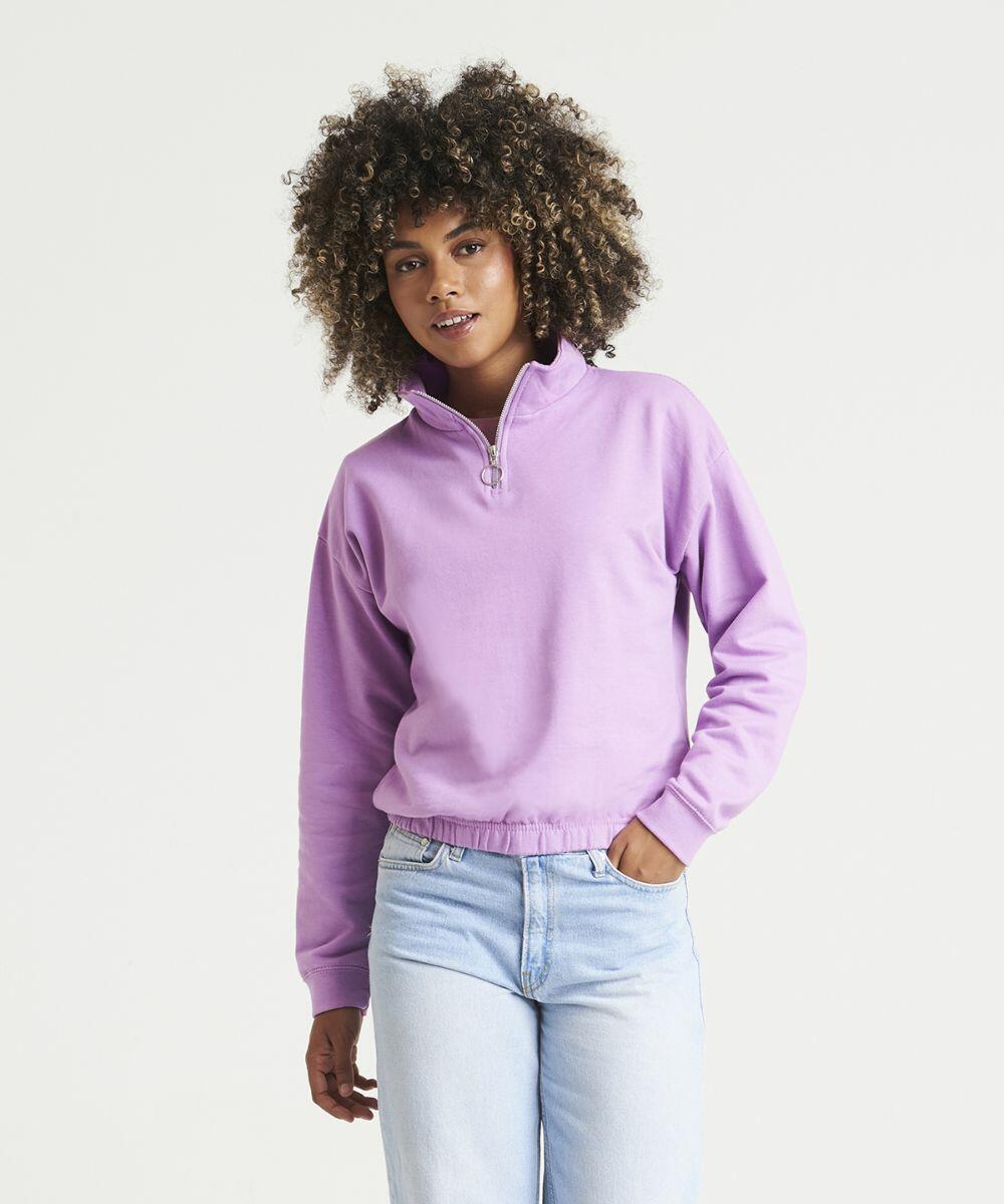 Person wearing a light purple JH037 by AWDis Just Hoods and light blue jeans stands against a plain white background.