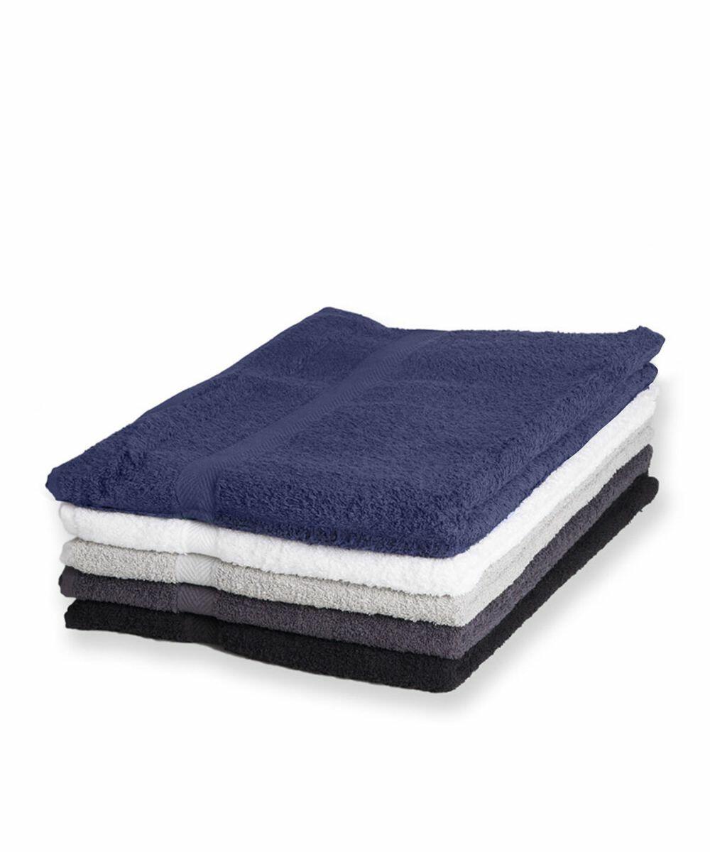A neatly folded stack of five Towel City TC006 towels in varying shades: dark blue, white, light gray, dark gray, and black.