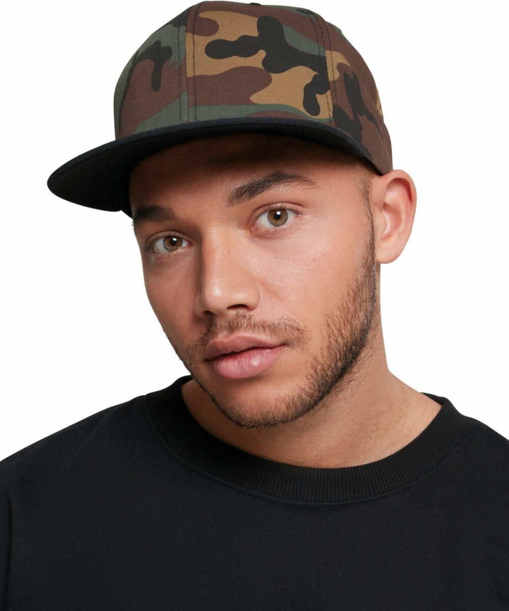 A man wearing a Flexfit By Yupoong YP089 cap and a black shirt, looking directly at the camera.