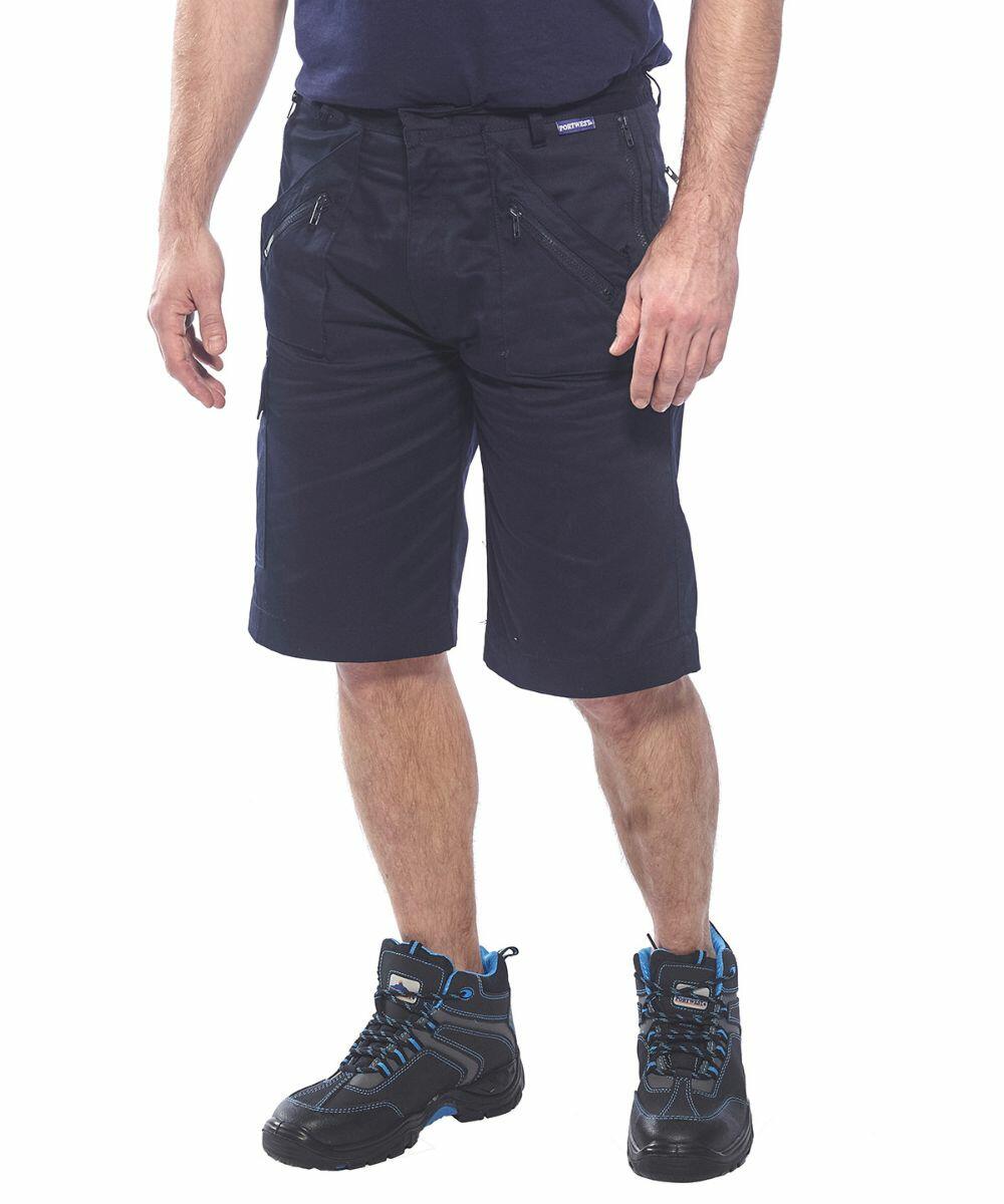 Man wearing black cargo shorts and black Portwest PW103 hiking shoes with blue accents, standing against a white background.