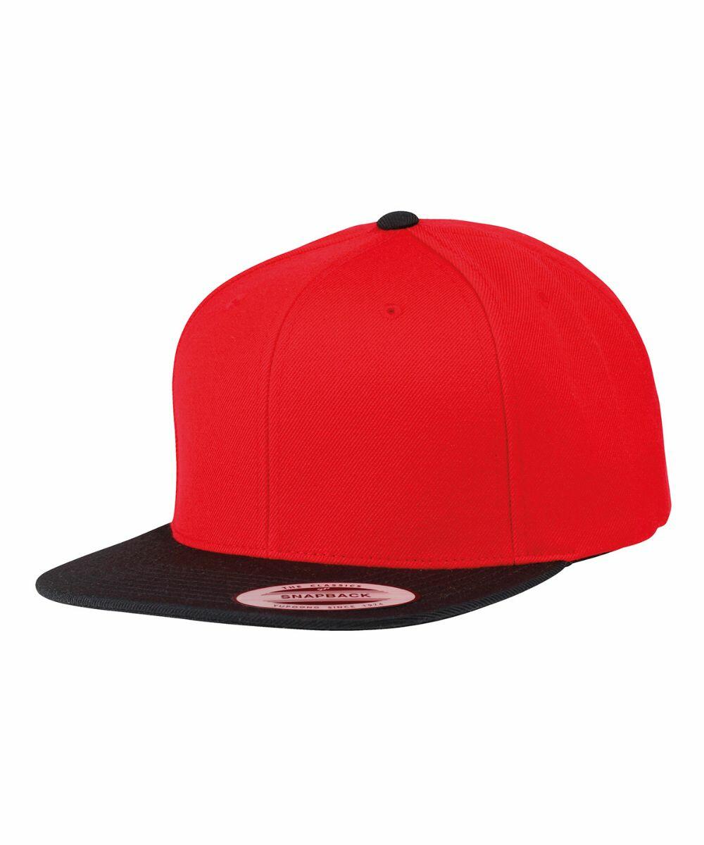 Red and black flat-brim snapback cap with label on the brim, Flexfit By Yupoong YP010.