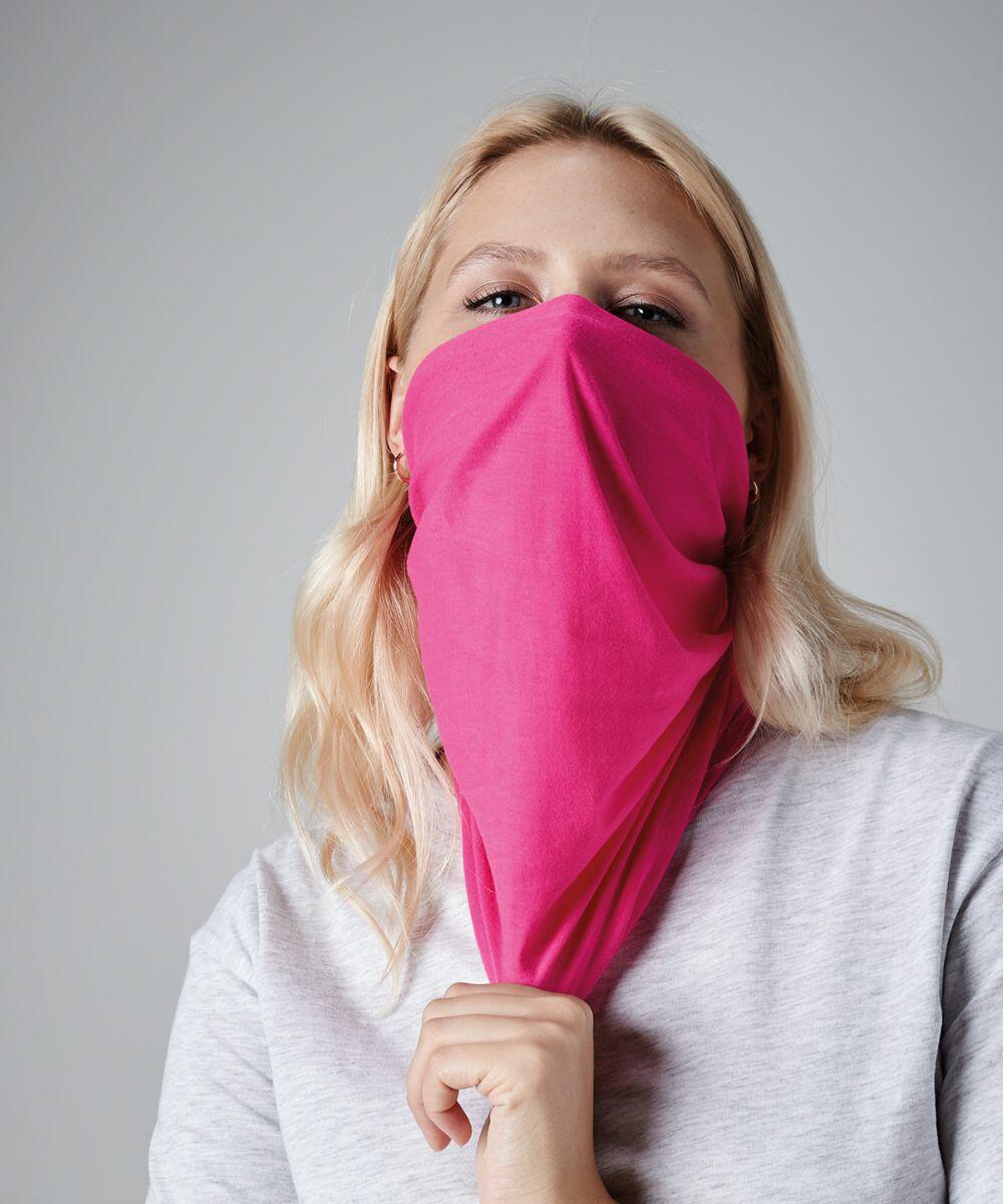 A person with long blonde hair is wearing a light gray shirt and has partially covered their face with a Beechfield BC900, leaving only their eyes visible. The background is a plain gray color.