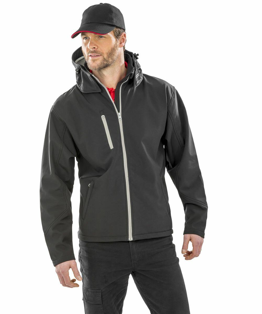 A man wearing a Result R230M black jacket with a hoodie and a cap, standing with his hands by his sides.
