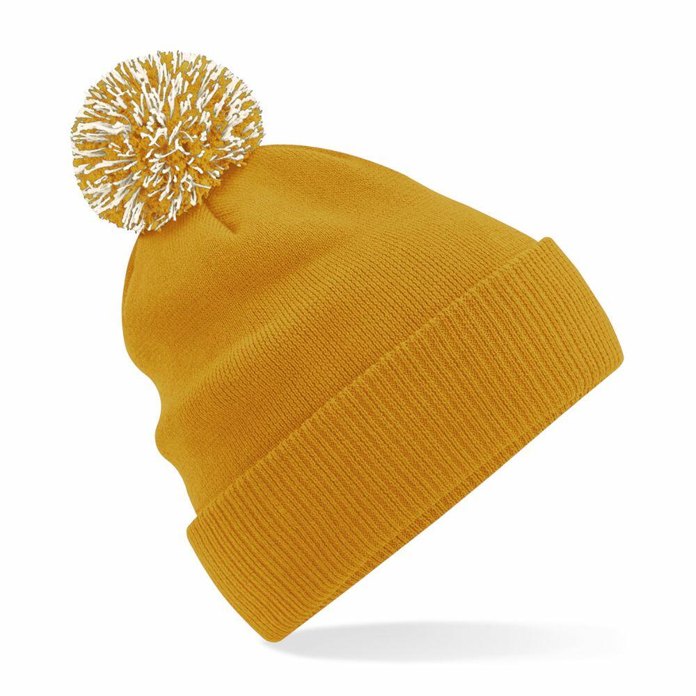 Beechfield's BC450 is a mustard yellow knit beanie featuring a white and yellow pom-pom on top, shown against a plain white background.