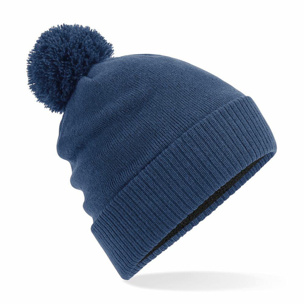 A blue Beechfield BC502 knitted winter hat with a pom-pom on top.