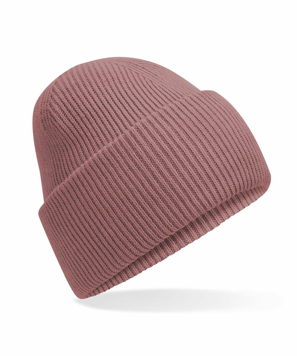 The Beechfield B385R beanie is a dusty rose, ribbed knit hat with a folded brim, showcased against a white background.