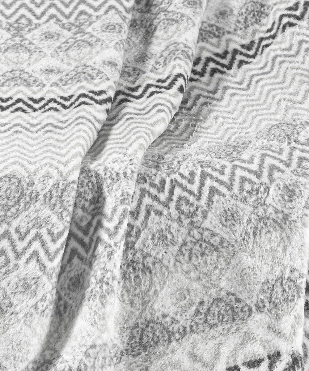 Close-up of textured fabric from Home & Living's HL210, featuring a gray zigzag and geometric pattern.